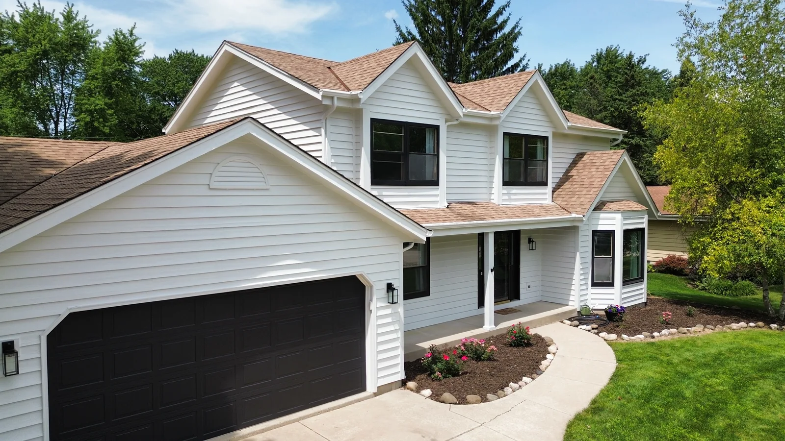 Finished exterior refresh from aerial driveway angle