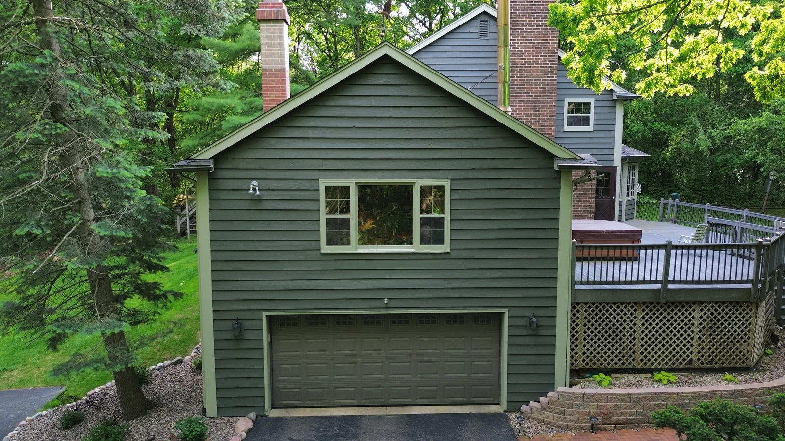 Finished garage side exterior repaint from aerial view